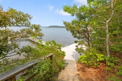 Follow the wooded path to the dock where you can soak up the sun and enjoy sweeping water views.