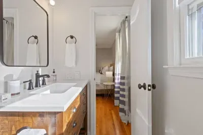 Right off the main bedroom, complete with a shower, vanity, and toilet. We provide the body wash, shampoo, conditioner, and fresh towels!