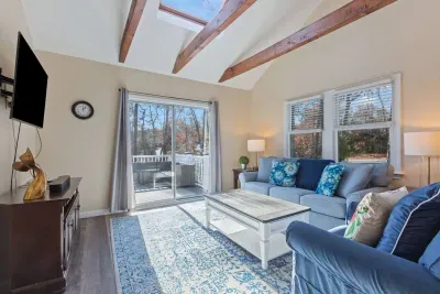 Enjoy your morning coffee feeling fully immersed in nature. The cheerful sunroom offers floor-to-ceiling views of the lush yard and filters in beautiful natural light all day.