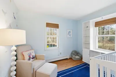 Decorated with sea life wall decals, it’s a calm, quiet corner where baby can nap peacefully while the rest of the family gathers nearby.