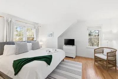 Coastal Calm: Our second King bedroom is located upstairs, offering a bright and airy escape. With plenty of natural light and plush bedding, it’s a serene spot to wake up refreshed and ready for a morning stroll on the nearby trails.