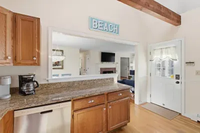 The kitchen's pass-through window and "BEACH" decor keep you connected to the family fun in the living area while you prep your favorite meals.
