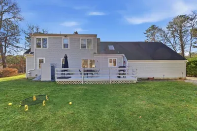 You can see the big, open backyard area that provides a wonderful, unfenced space for children to play freely during your stay..