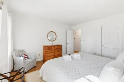 Drift off in a bright, peaceful bedroom featuring fresh linens for your quiet morning moments