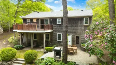 Private wooded retreat with deck, patio dining, and grill area