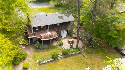 Secluded wooded retreat with elevated deck, patio, and peaceful outdoor space
