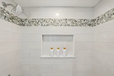 Let your tension melt away in a beautifully tiled space designed for ultimate relaxation. No need to unpack the essentials, indulge in premium shampoo, conditioner, and body wash from our sleek, built-in dispensers.