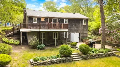 Private wooded retreat with large deck, patio, and beautifully landscaped yard