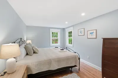 Bright, peaceful bedroom with natural light and serene garden views
