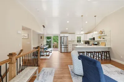Bright open-concept kitchen and dining space with island seating