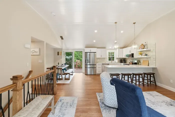 Bright open-concept kitchen and dining space with island seating