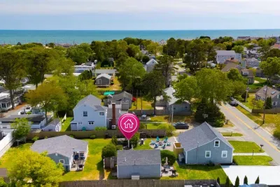 The cottage is located in the middle of the property. You'll have dedicated parking, plus an outdoor patio featuring a BBQ and outdoor table. The backyard is a communal space, shared with guests in the front cottage.