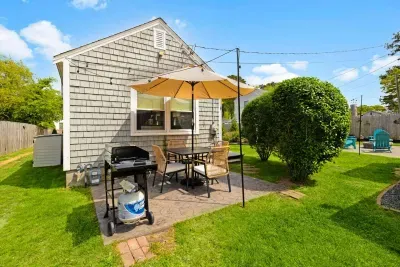You'll have your own space to cook something delicious on the propane BBQ grill, or easily grab beach chairs, beach towels, and beach items from the shed container on the left side.