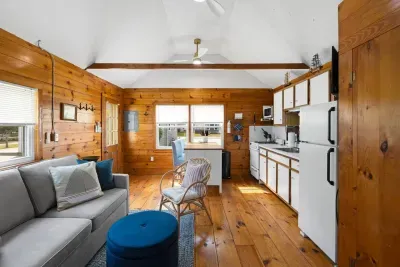 With a sofa bed on the left and a convenient cooking area on the right, this space is perfect for smaller groups.