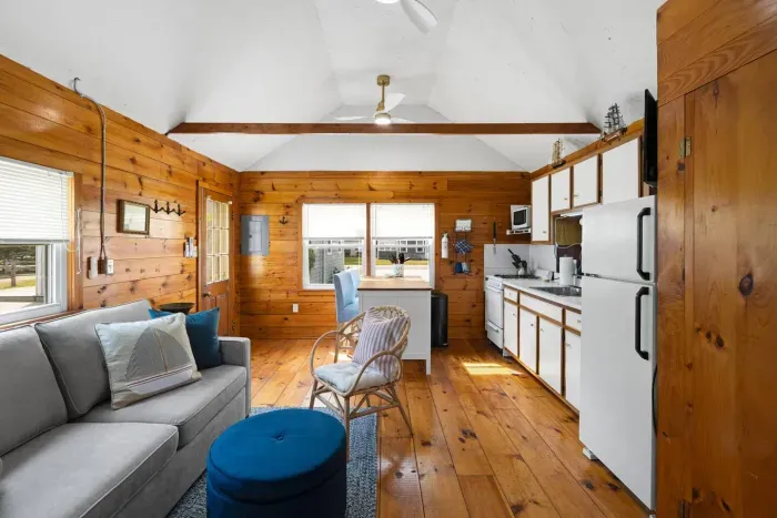 With a sofa bed on the left and a convenient cooking area on the right, this space is perfect for smaller groups.