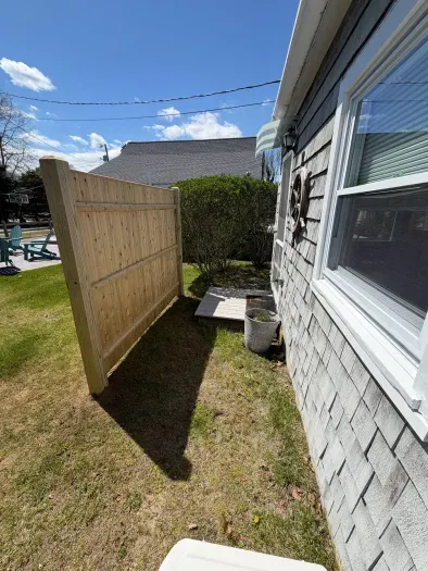 Private side yard with new fencing and easy outdoor access