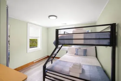 Bottom is a full size, top bunk is a twin