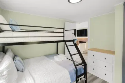 Bottom is a full size, top bunk is a twin