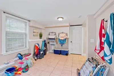 Beach-ready storage space with chairs, coolers, towels & gear