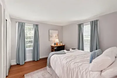 Bright and cozy bedroom with natural light and soft, calming decor