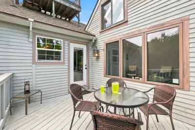 Private deck with outdoor dining and bright windows