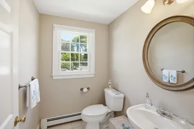 Crisp, bright, and impeccably clean, this convenient half bath is thoughtfully stocked with premium essentials, offering guests a comfortable and refreshed experience throughout their stay.