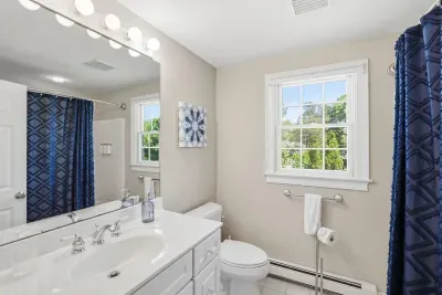 Plenty of room to primp, pamper, and prep for the day ahead. This bright, sparkling bathroom combines fresh modern styling with a generous vanity, offering a beautifully serene spot to refresh your senses.