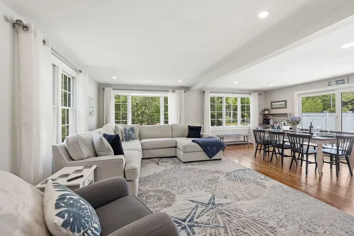 Flooded with daylight and framed by massive windows, this airy haven brings the beauty of the outdoors in. Stretch out on the sprawling sectional, share a laugh at the dining table, and let the easy vacation breeze take over.