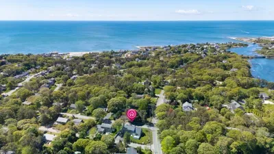 Peaceful coastal retreat near the beach in a lush, tree-lined neighborhood
