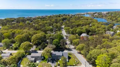 A bird's-eye view of pure tranquility. Tucked away under a lush canopy of trees, your spacious yard and private deck offer a beautiful, secure escape where the outside world completely disappears.