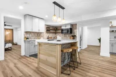 Hang out at the island while chatting in the open kitchenette