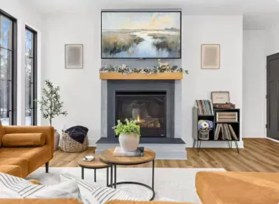 Spacious open concept living room with 65" smart TV, propane fireplace, and plenty of seating for all!