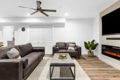 Enjoy a cozy evening by the electric fireplace in the basement living room