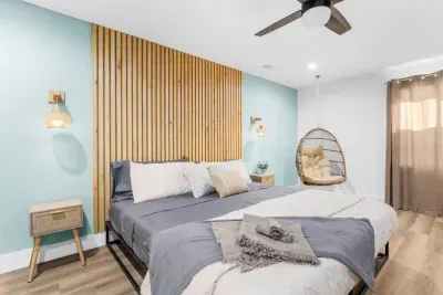 Basement master bedroom with hanging egg chair and makeup vanity all within the convenience of your own room! 