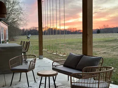 Sit on the cozy swings while watching an amazing shnset