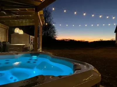 Relax in the Hot tub under the stars with the cozy ambiance of string lights overhead to complete your evening!