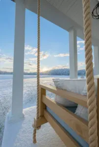 Grab a blanket and enjoy the stunning unobstructed sunset views from the front porch swing, sure to be picturesque!