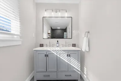 Double vanity with lots of counter space in the master bedroom bathroom.