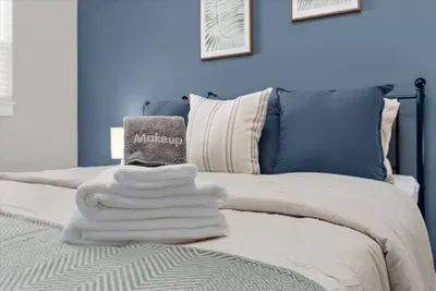 Makeup towels and bath towels provided on every bed for all of our guests!