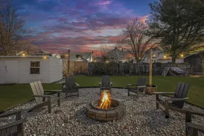 Grab marshmallows and your favorite snacks and enjoy a cozy starlit evening by the outdoor wood burning firepit with seating for 8!