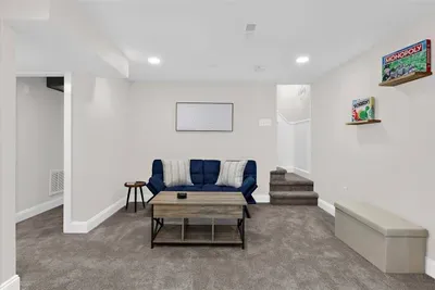 Downstairs living room with plenty of space for activates such as boardgames, a movie night, or a quiet area to catch up on your favorite book!