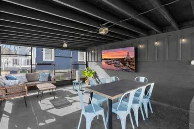 Watch your favorite sporting events or shows in the comfort of the outdoor screened in porch with seating for all, a cozy hanging egg chair, and nighttime string lights!