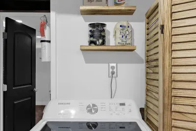 Full size washing machine and dryer with laundry detergent pods provided in the downstairs laundry room for our guests convenience.