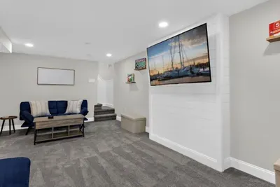 Convenient 2nd living room located downstairs with smart TV, futon sitting areas, and board games for all to enjoy!