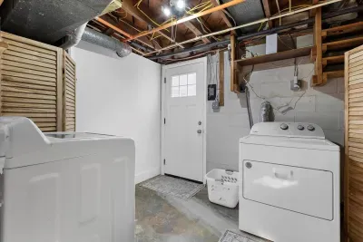 Full size washing machine and dryer located in the lower-level portion of the house.