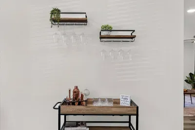 Mix up your favorite cocktails or pour your favorite glass of wine over at the dining room bar cart!