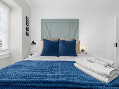 Bedroom #2, Queen mattress, smart TV, and a beautiful view of Historic Downtown Annapolis from the window.