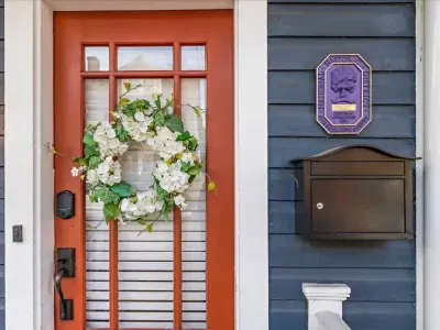 Additional front door photo showing the Historic house placard!