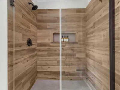 Full size custom tile walk in shower stocked with body wash, conditioner, and shampoo for all of our guests.