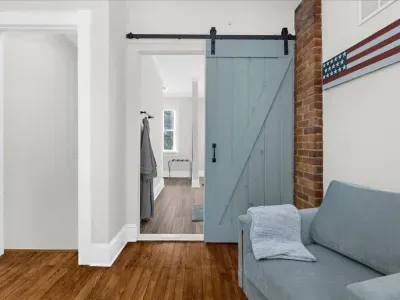 Private full bathroom within bedroom #2 with a walk-in shower, double vanity, Poo Pourri, soaps, conditioner, and shampoo.